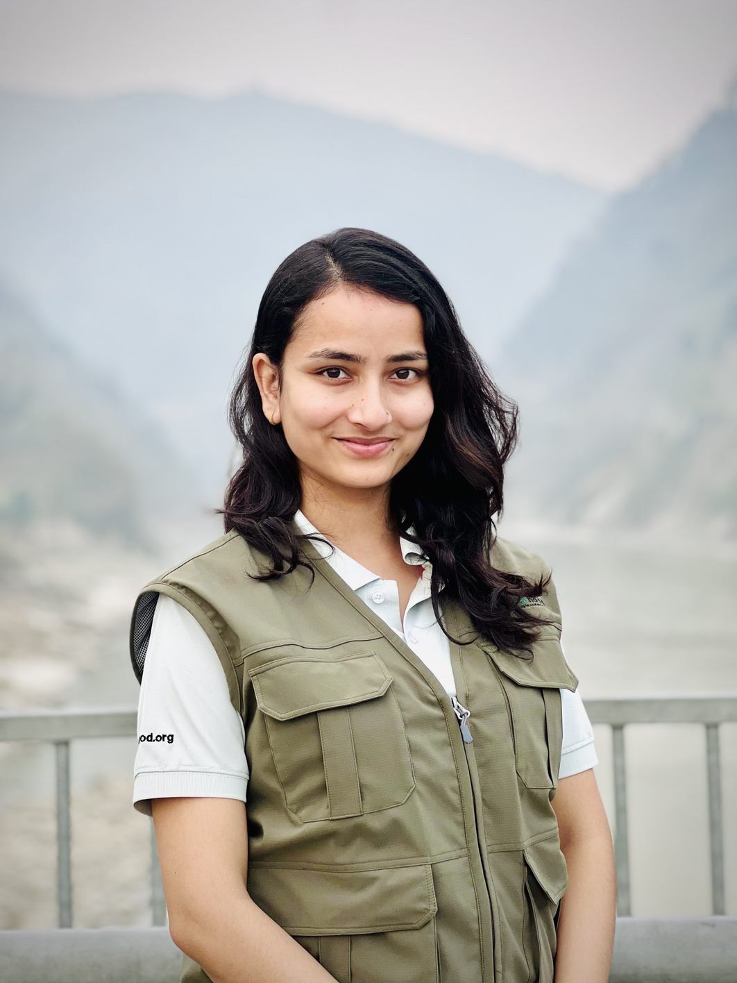 Portrait of Elisha Ghimire in a Greenhood Nepal field vest